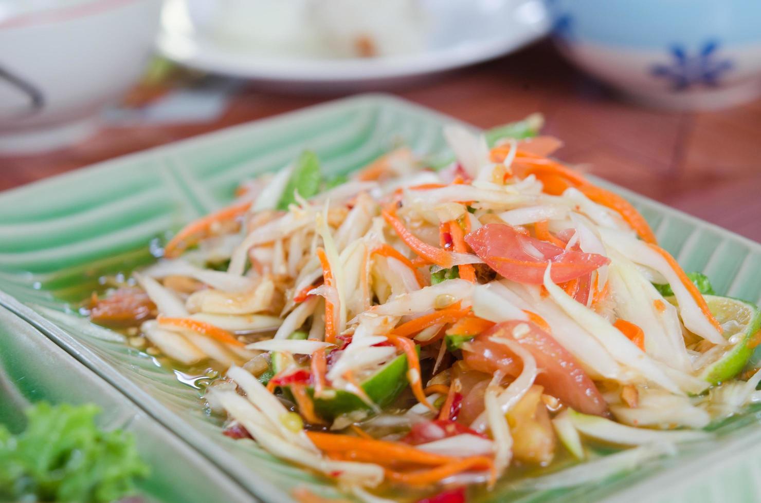 ensalada de papaya comida tailandesa, som tam foto