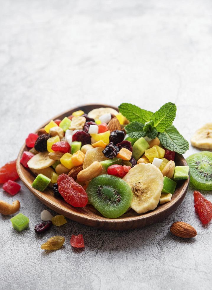 Bowl with various dried fruits and nuts photo