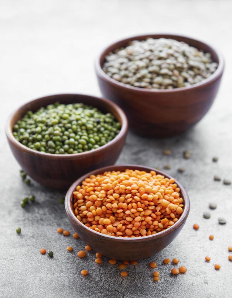 Bowls with different types of legumes photo