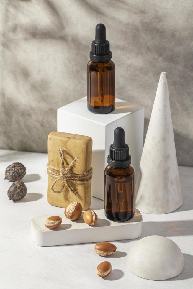 Minimal background of argan oil care composition photo