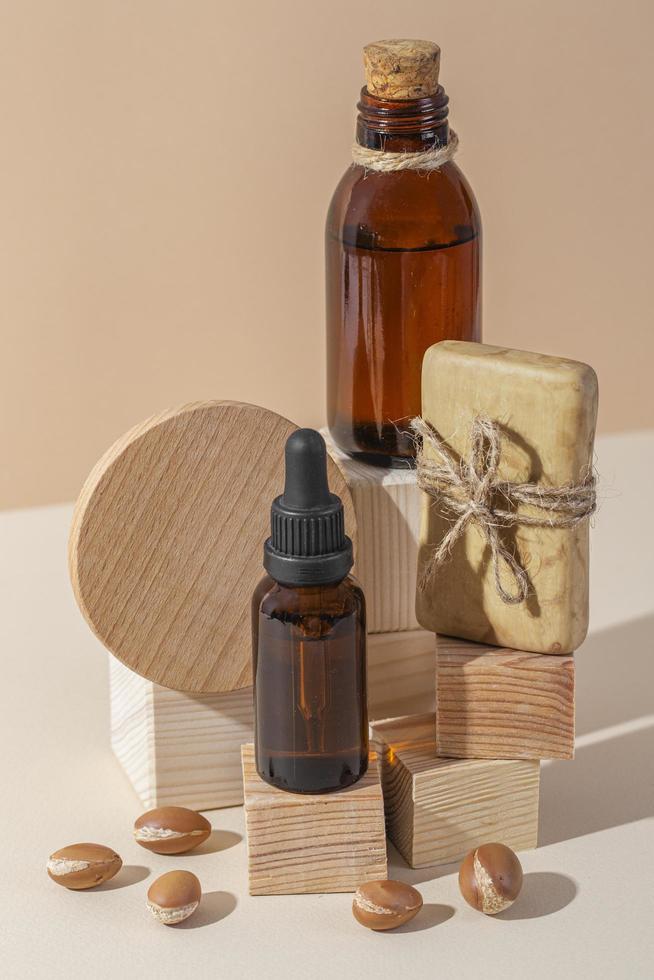 Minimal background of argan oil care composition photo