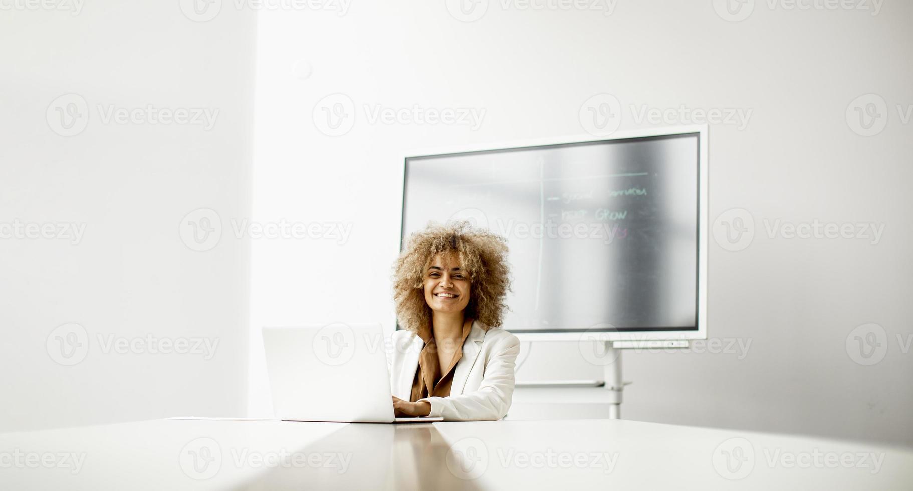 Woman working in a meeting room photo