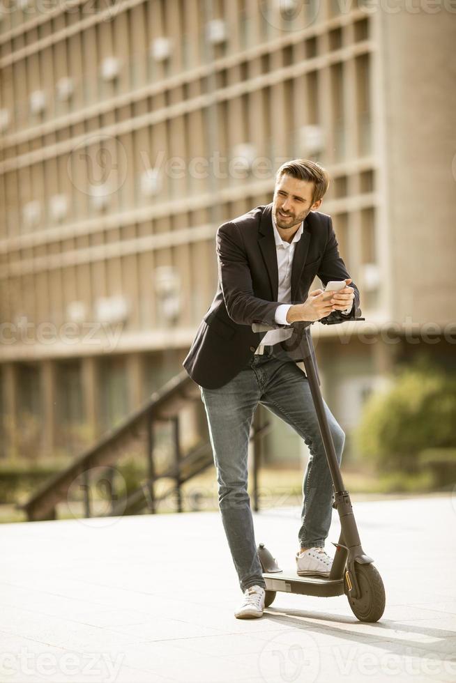Man riding scooter photo