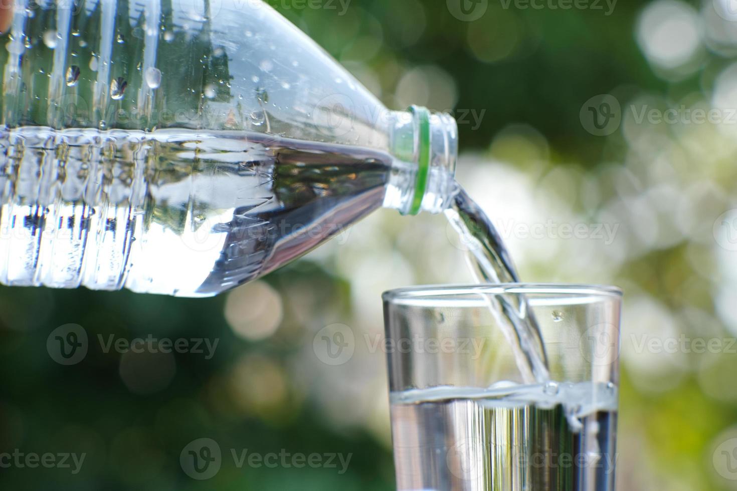 Drinking water on wood table and space for text photo