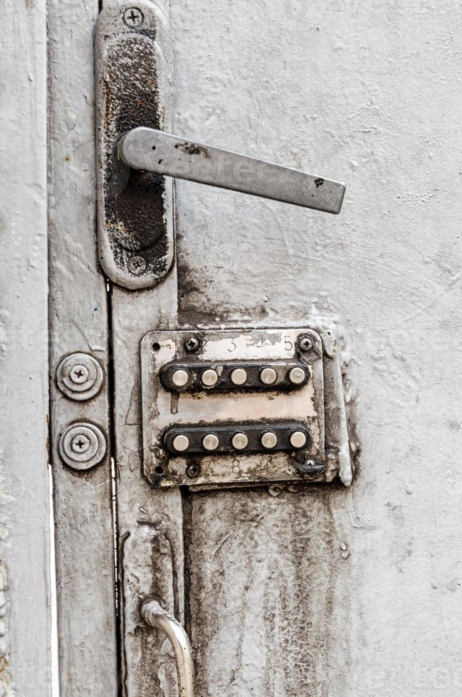 Old digital combination lock on an iron door photo