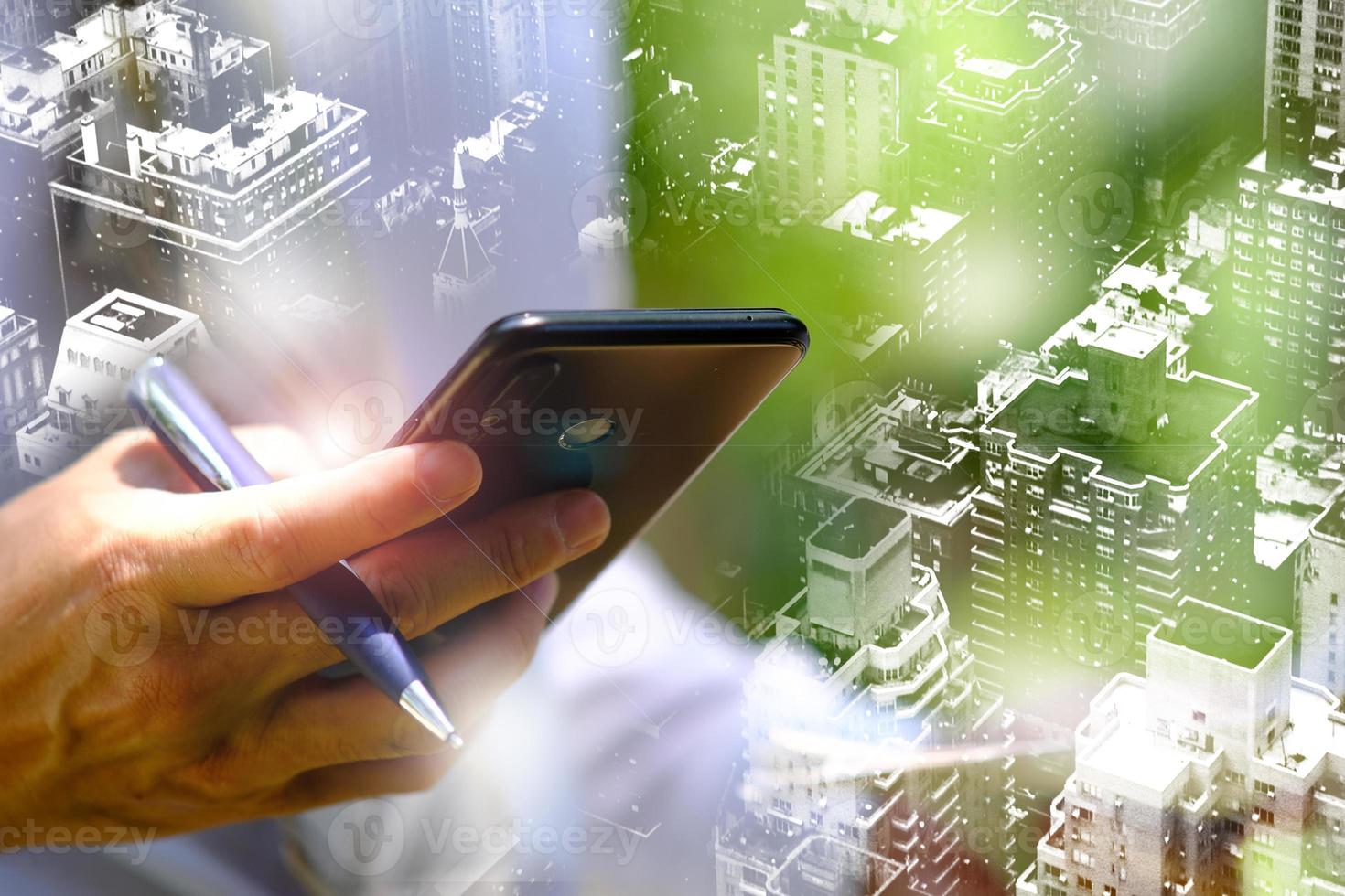 Businessman using a smartphone and working on technology concept photo