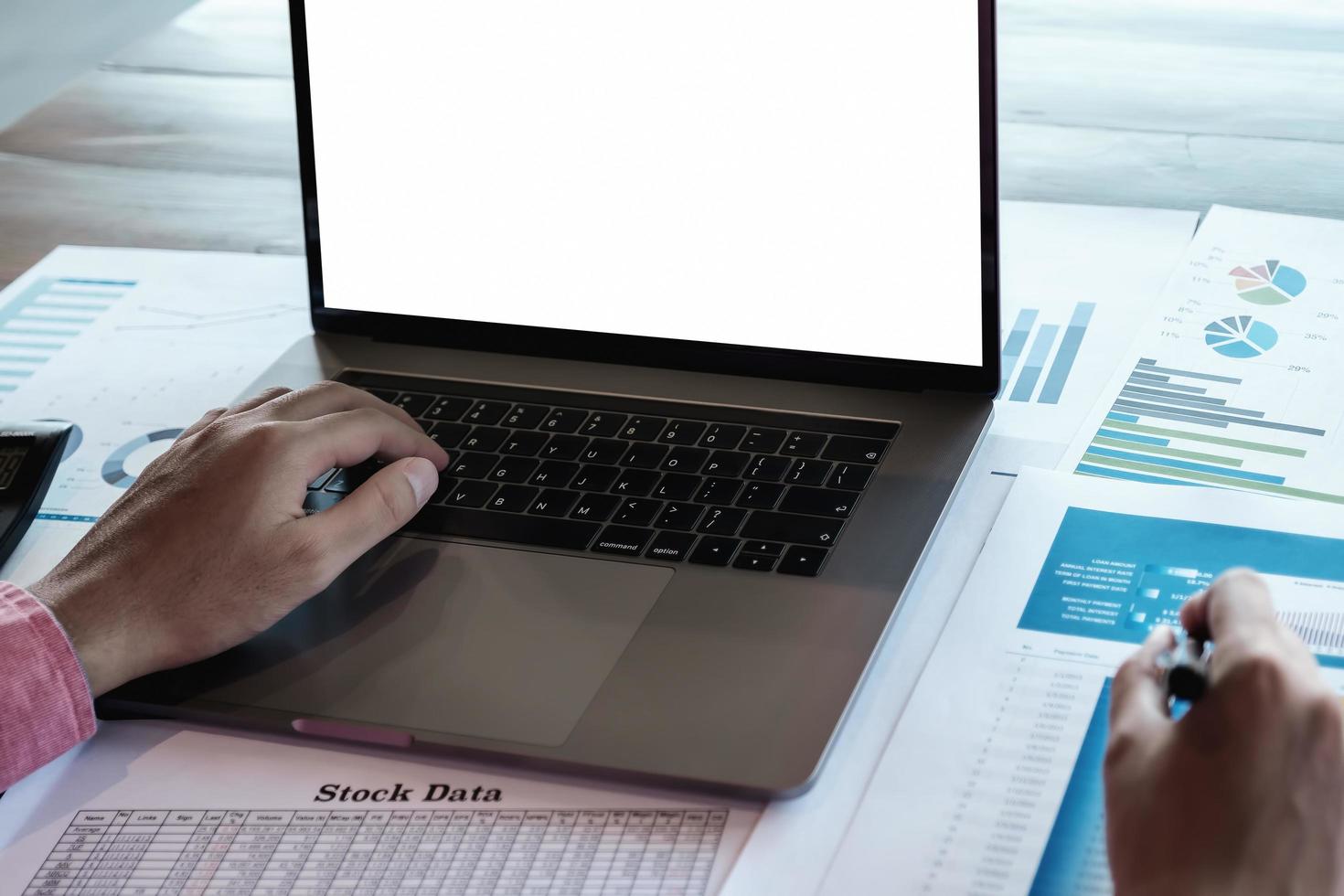 Stock marketing analysis concept, Male using computer laptop to analyze stock market chart data application in office. photo