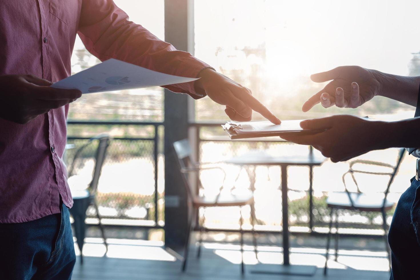 Investor or Analyst or Consultants or economist concept. Businessmen and partners are discussing to find a conclusion in the stock market. photo