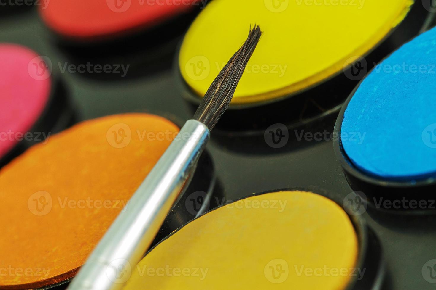 Close up of Water color paints and brush photo