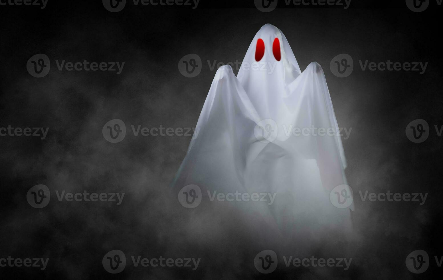 White ghost on black background photo