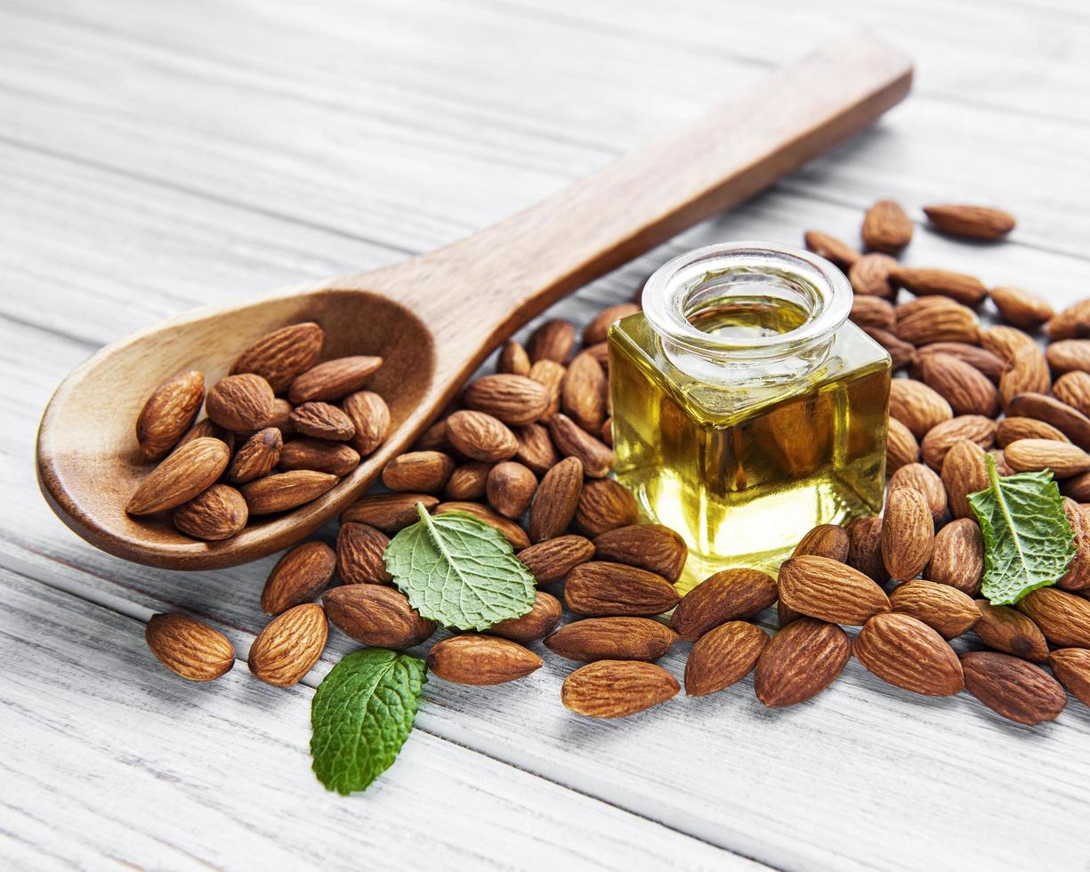 Almond oil and almonds photo