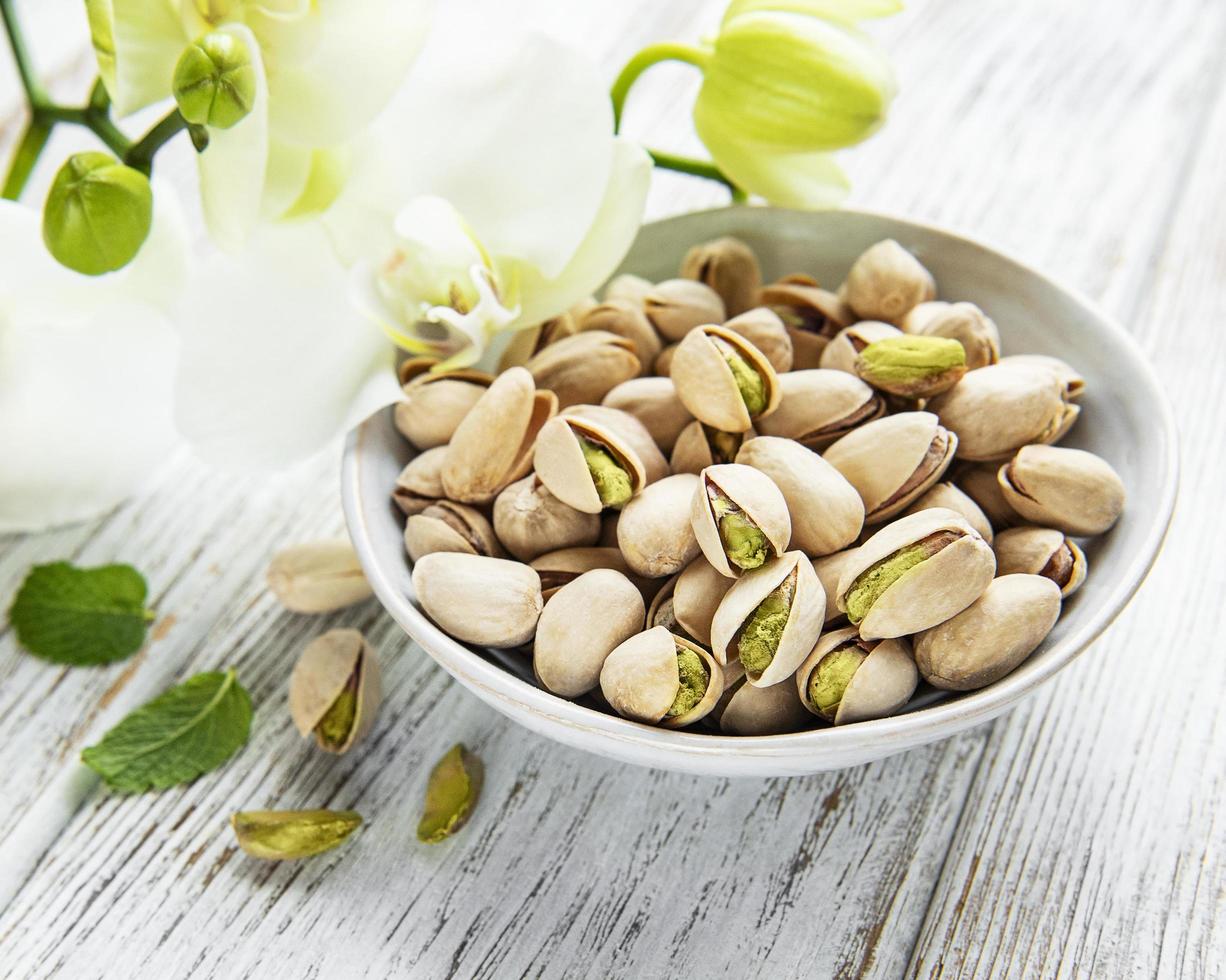 Bowl with pistachios photo