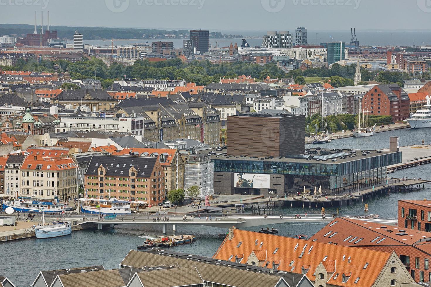 Skyline of scandinavian city of Copenhagen in Denmark during a cloudy day photo