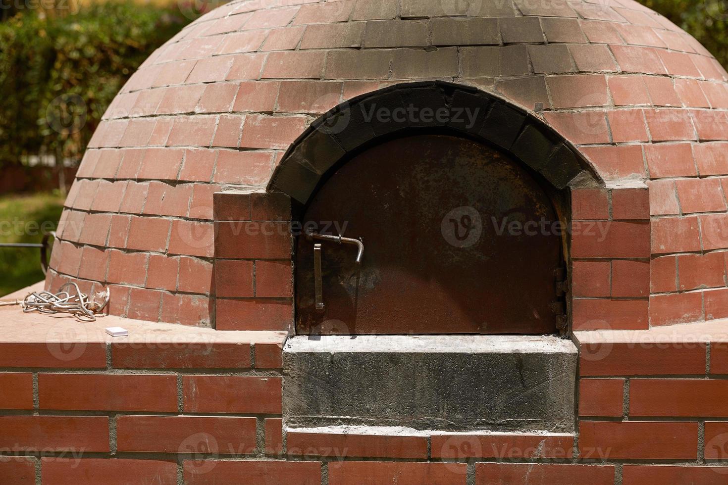 Close Up of Small Rural  DIY Brick Smokehouse Ready for BBQ photo