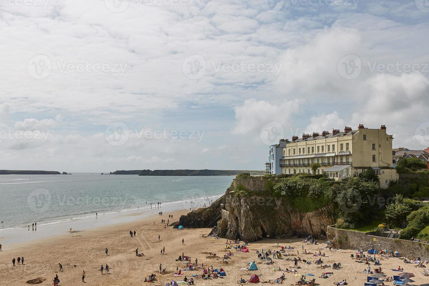 People on a beach in Tenby Wales UK photo