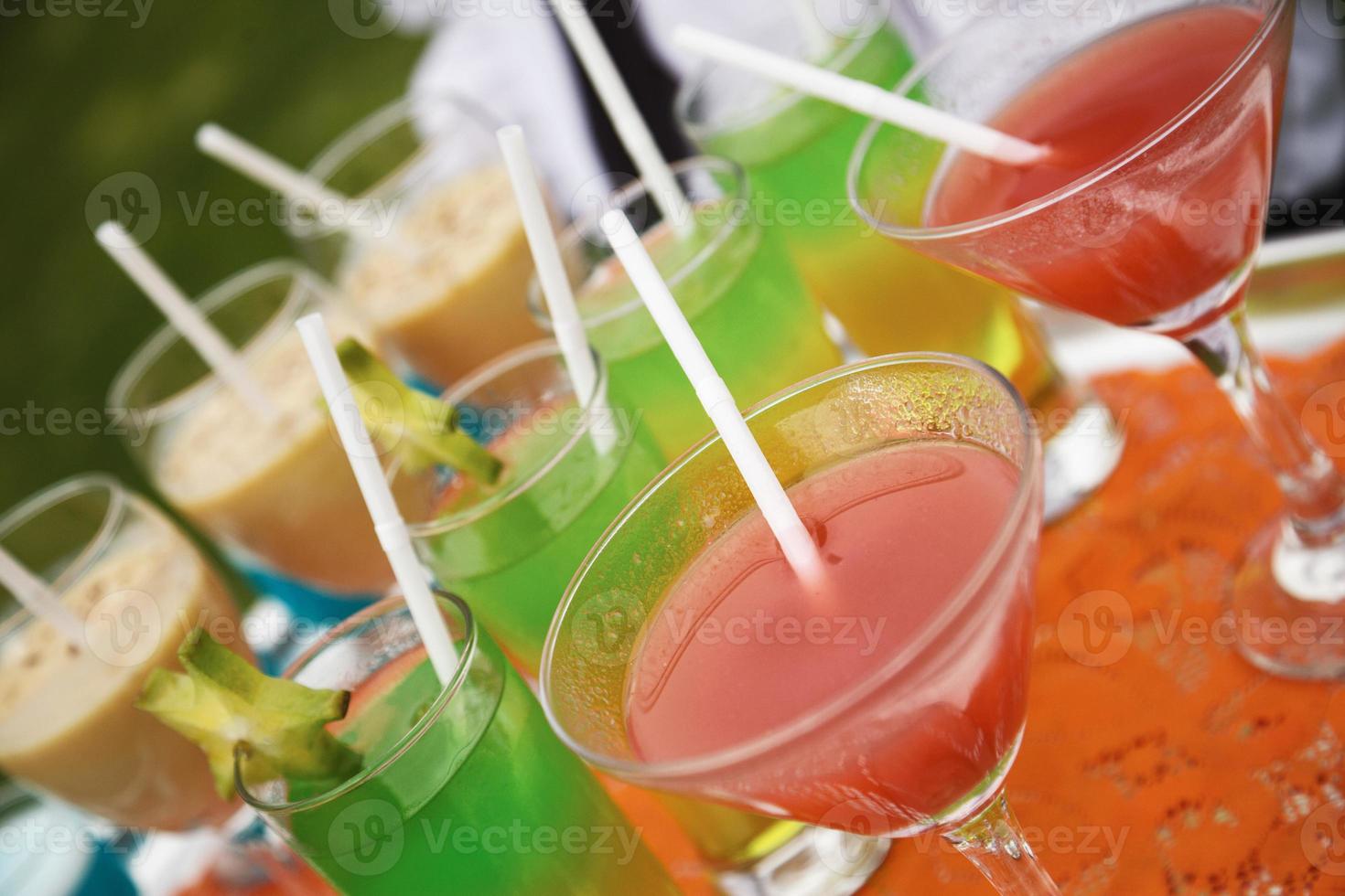 Alcohol coctail set on waiter tray photo