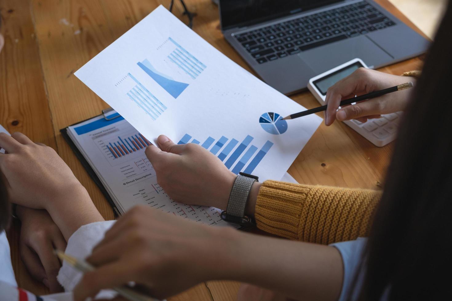 Group of businesspeople brainstorming, investment consultant analyzing company financial report balance documents. Fund manager concept. photo