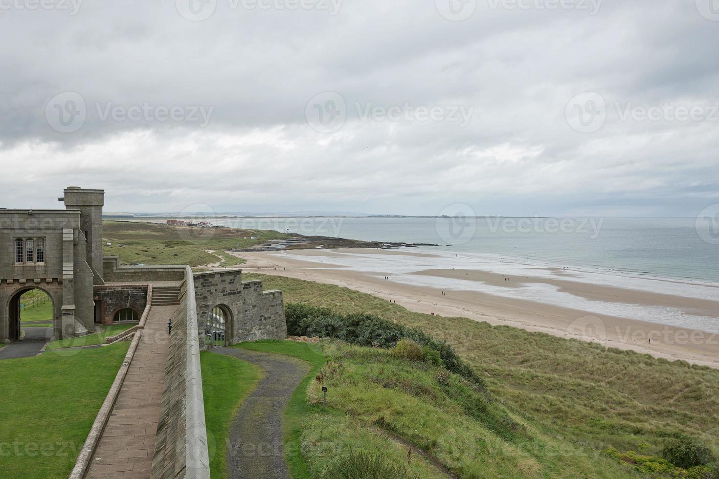 View of a beach from Bamburgh Castle in Northumberland England UK photo