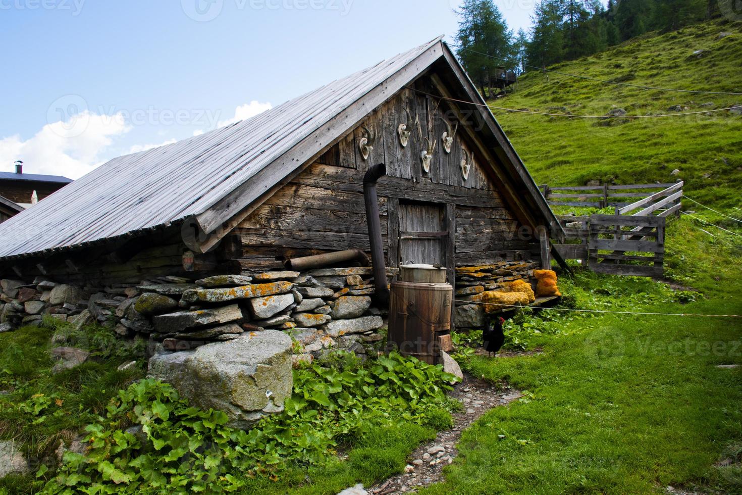 Mountain hut and clouds photo