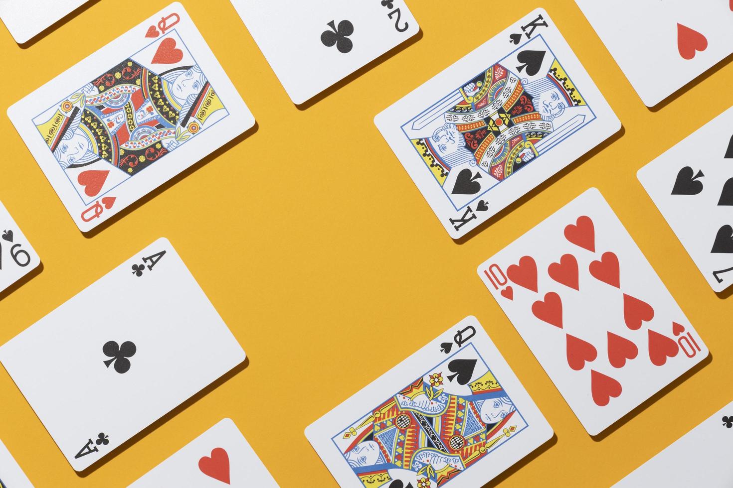 Casino cards on yellow background photo