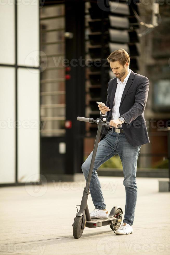 Vertical view of a man on a scooter photo