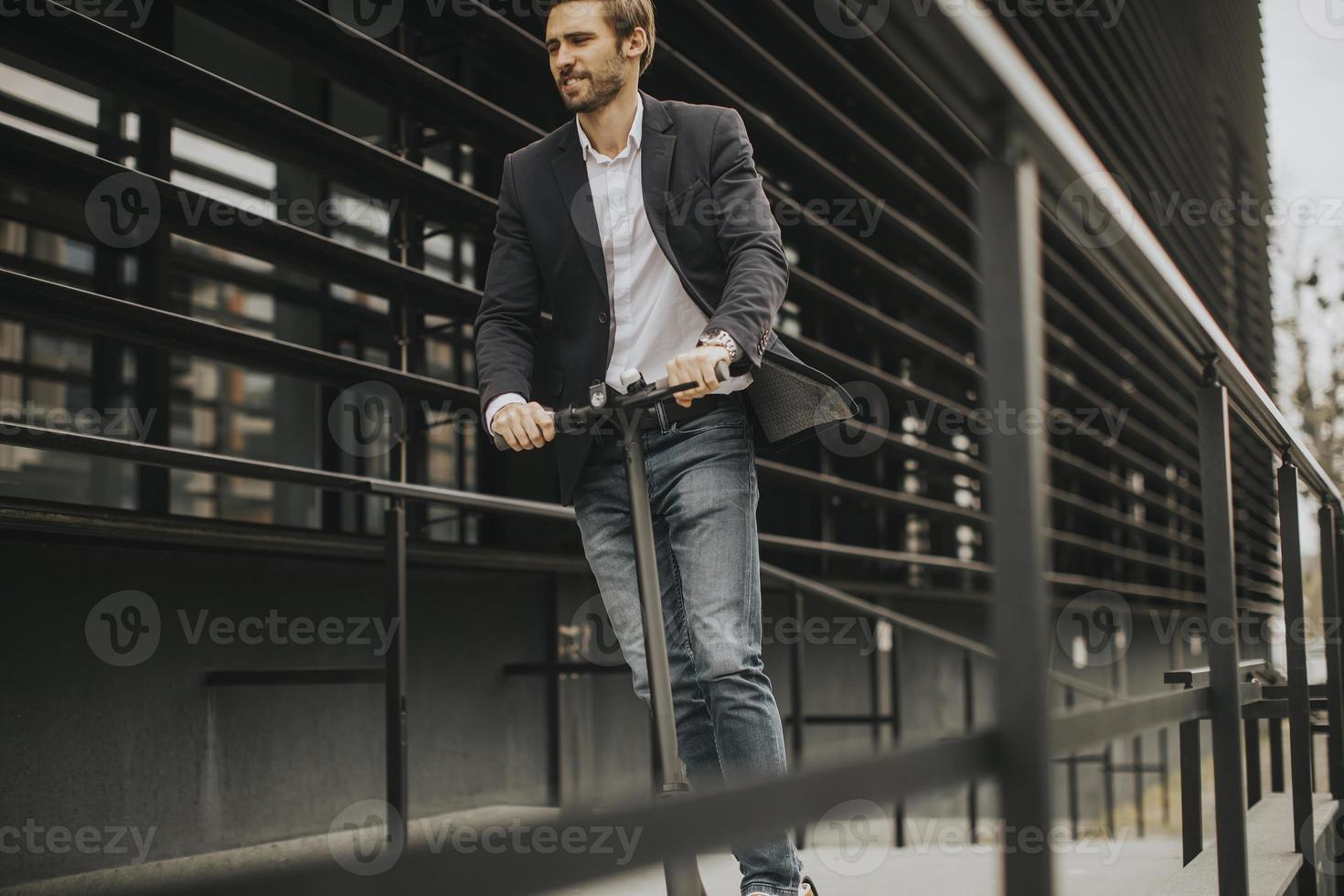 Businessman on a scooter photo