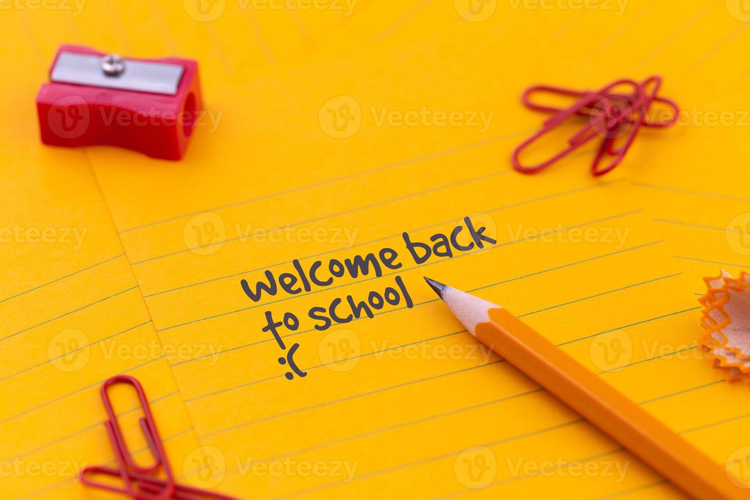 Back to school stationery and orange sheet of paper photo