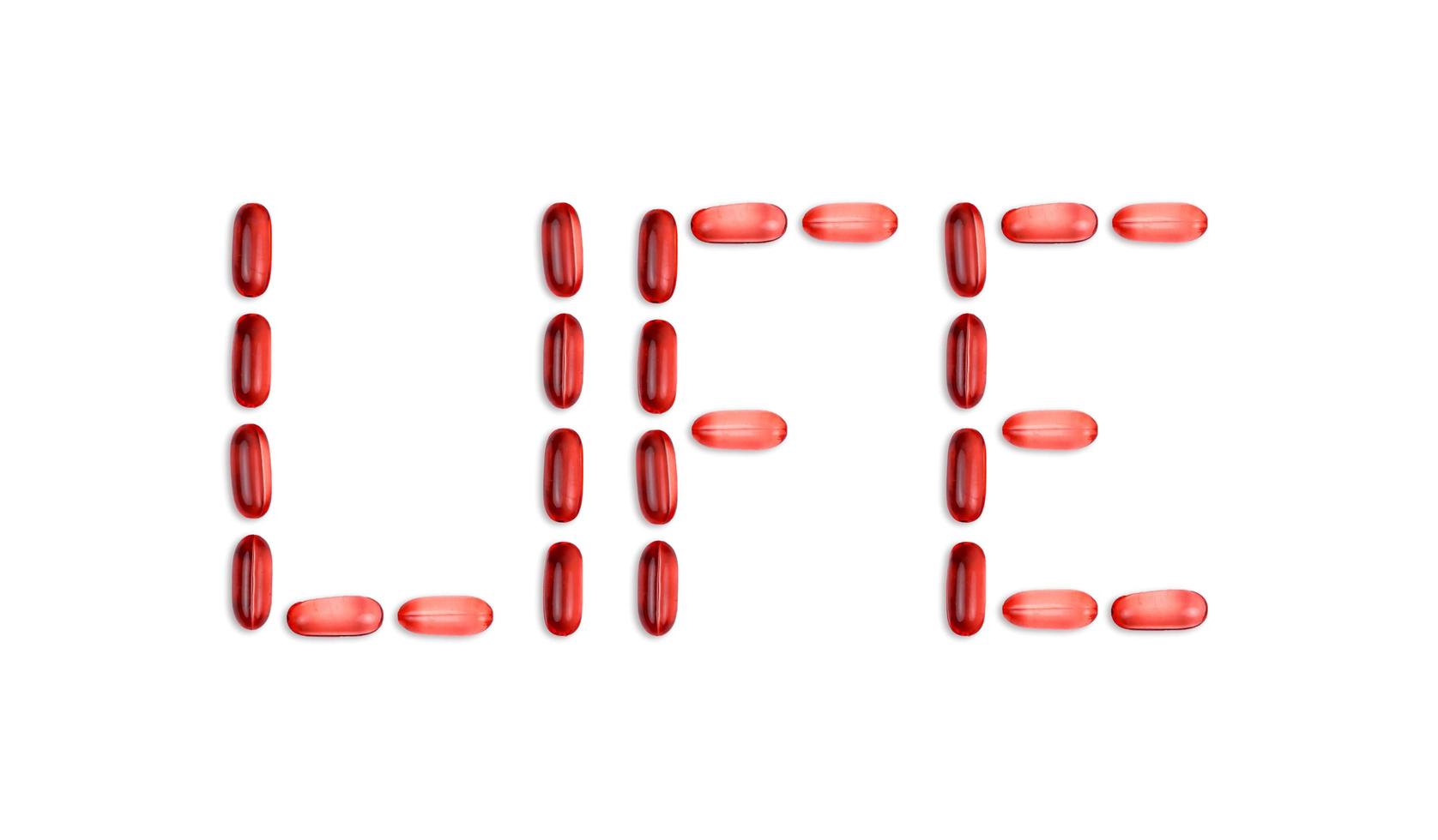 La palabra vida se presenta con pastillas de gel sobre un fondo blanco con espacio para copiar texto foto