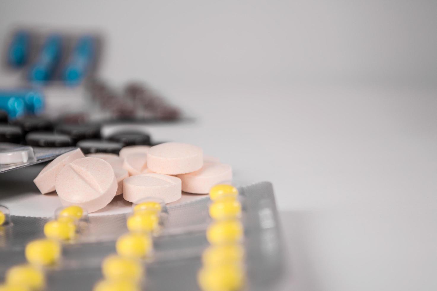 White medical pills and tablets with bottle photo