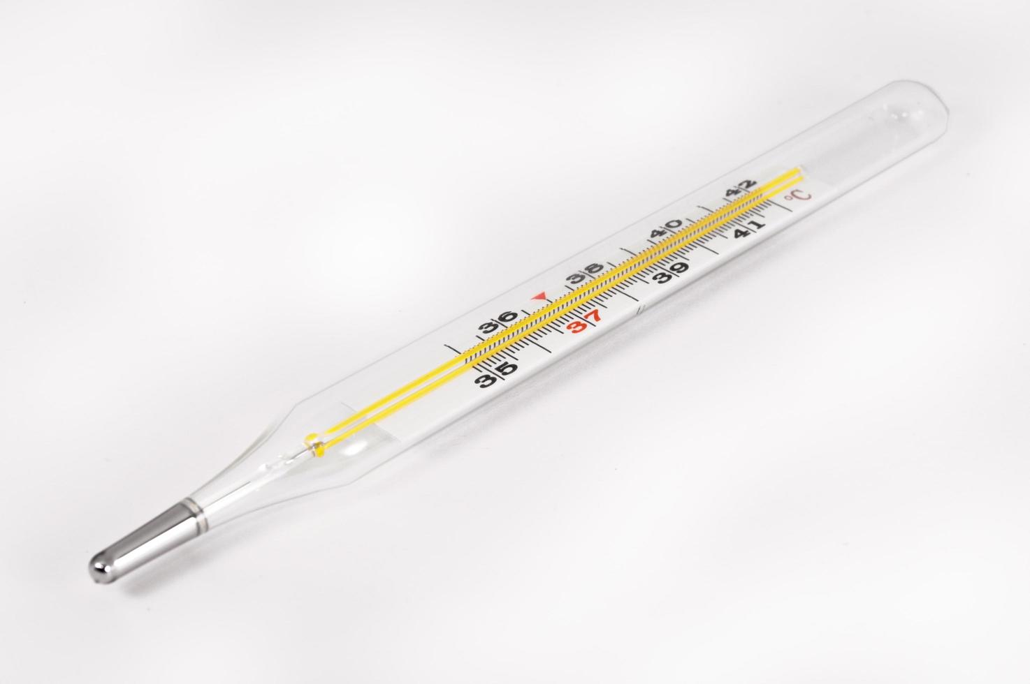 Thermometer closeup on white background photo