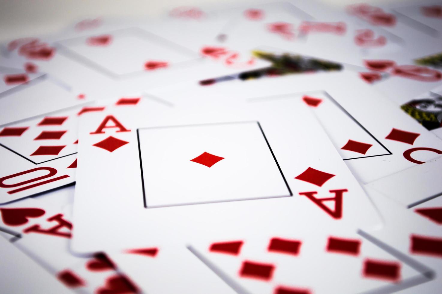 Red playing cards in chaos photo