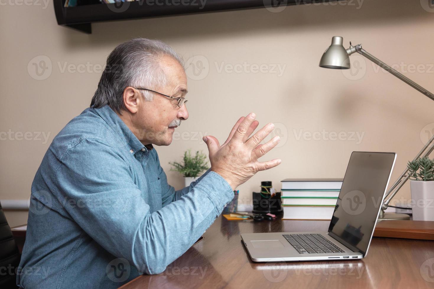 Senior man uses online communication photo