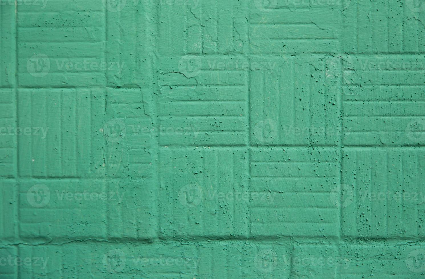 Decorative green painted wall with square and strips background texture photo