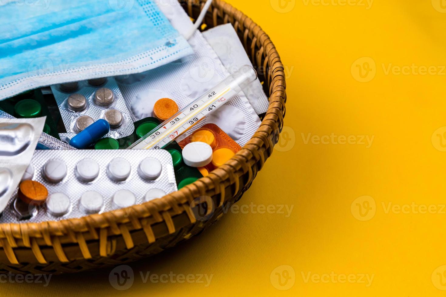 wicker basket on the yellow background photo