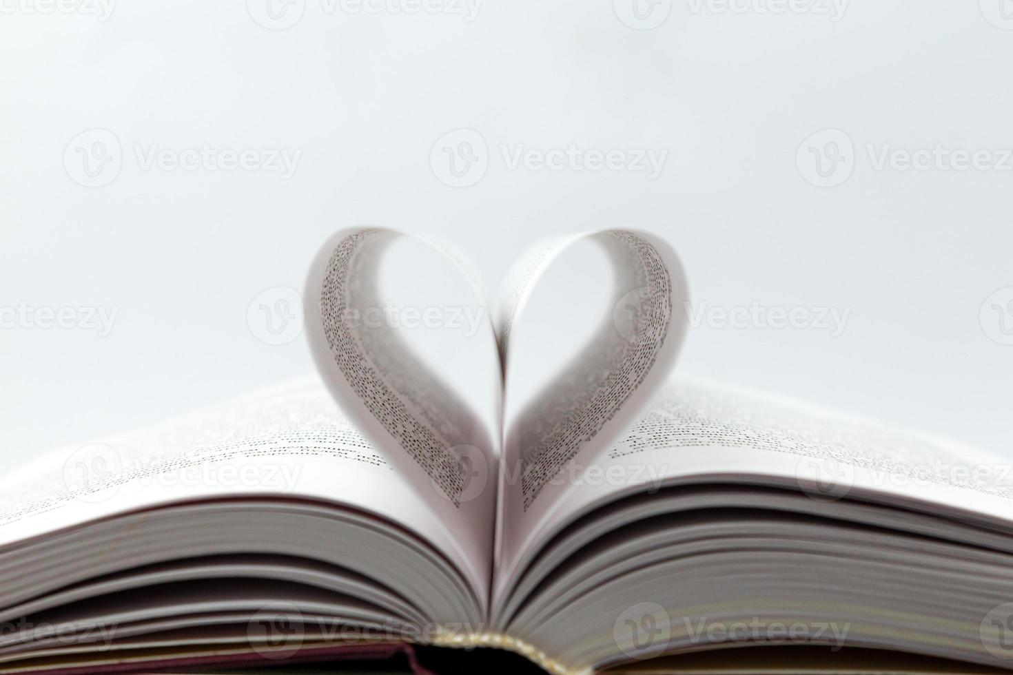 Opened book with heart page photo