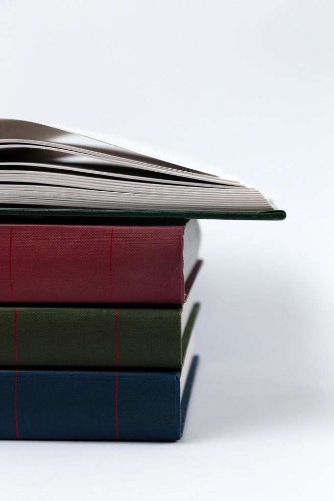 A stack of books lying on a white background photo