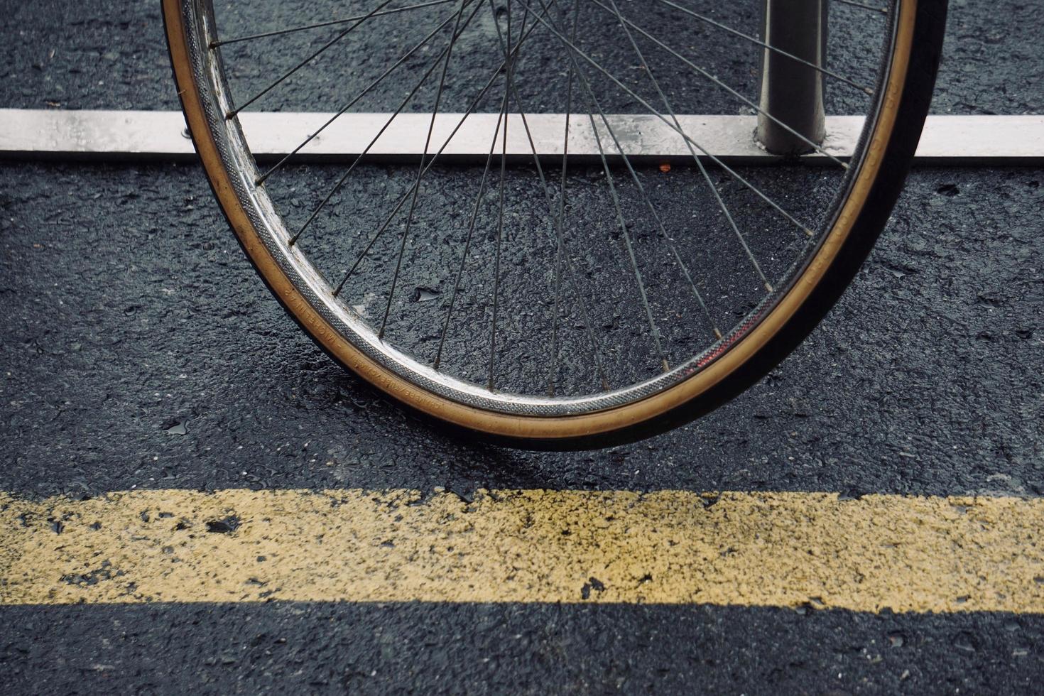 wheel of the bicycle on the street photo