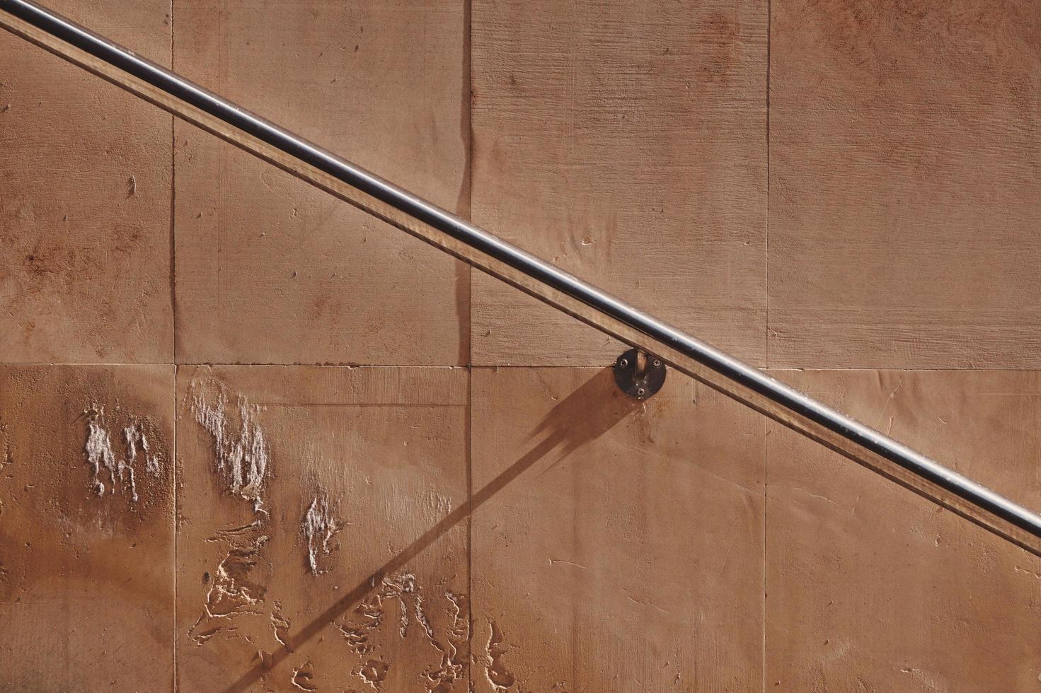 old wall of the building with a metallic railing photo