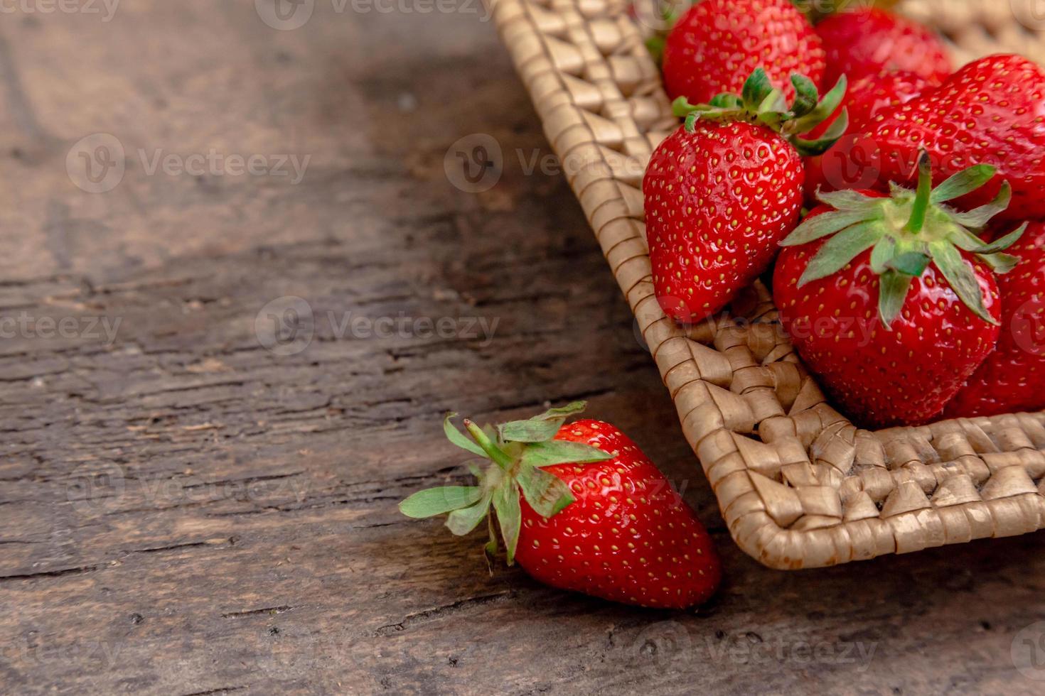 Fresh juicy strawberries in basket photo