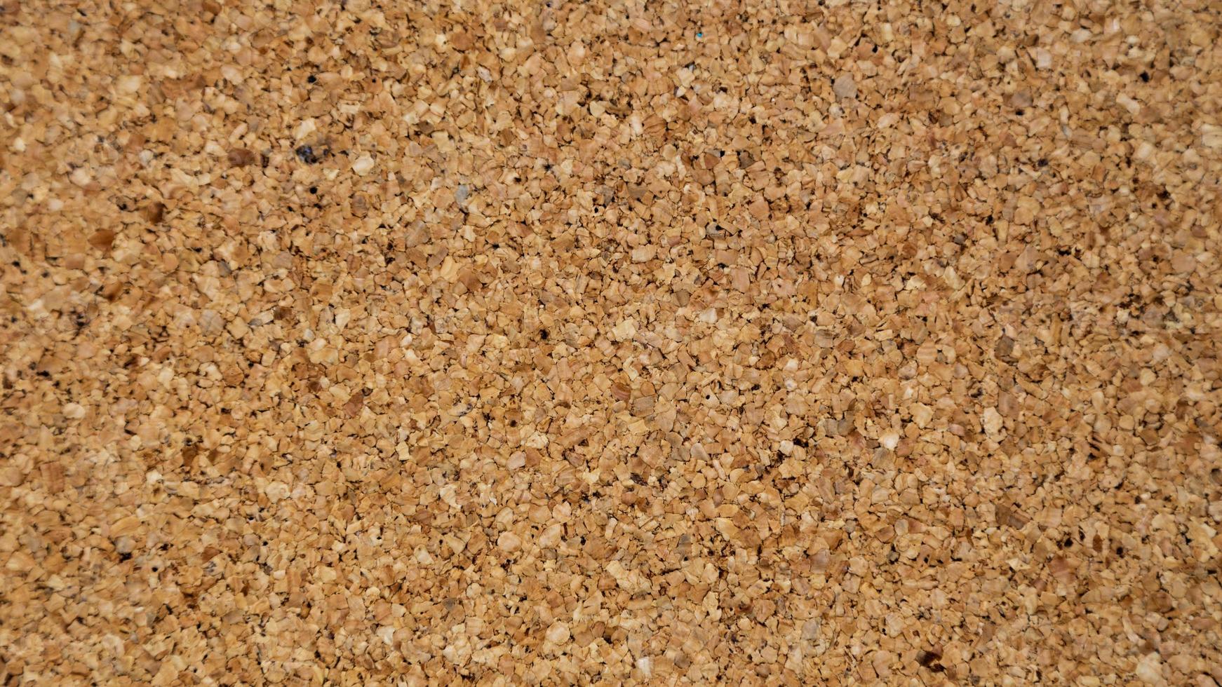 Close-up of brown cork board texture background photo