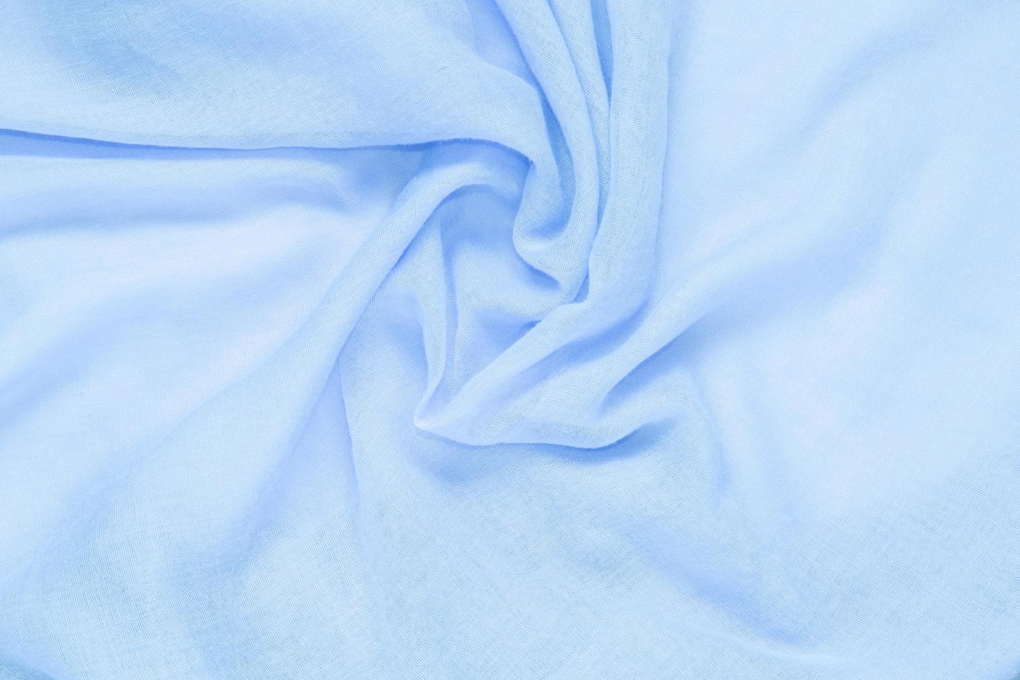 Delicate soft and wrinkled blue fabric photo