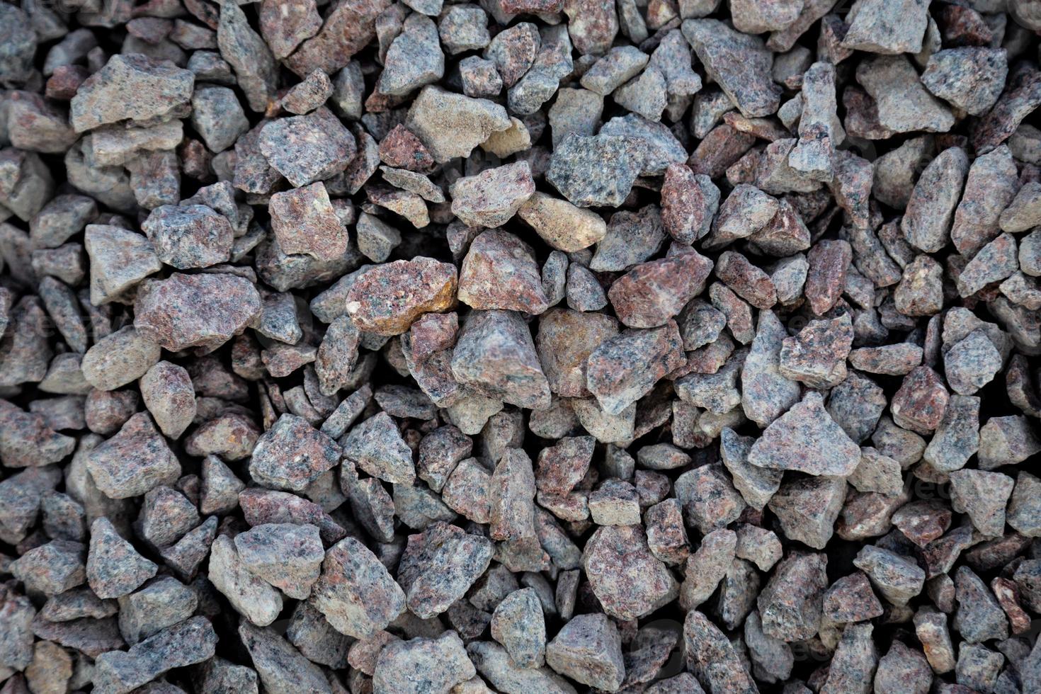 Crushed gray stone on the ground texture background photo