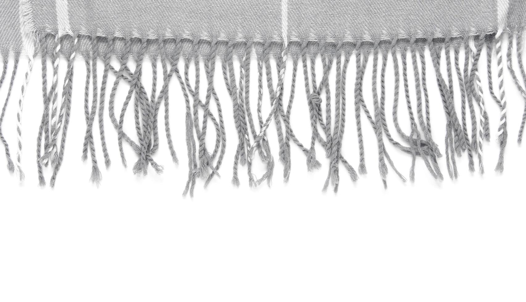 Part of a beautiful gray scarf isolated on a white background with an area for text photo
