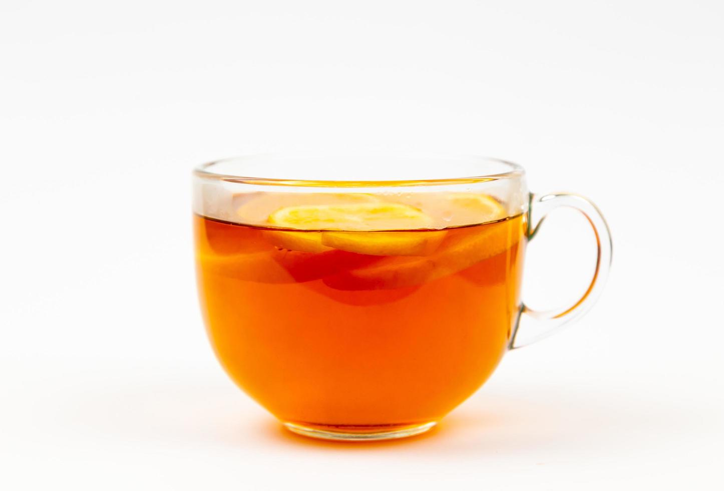 Tea in cup with leaf mint and lemon isolated on white background photo