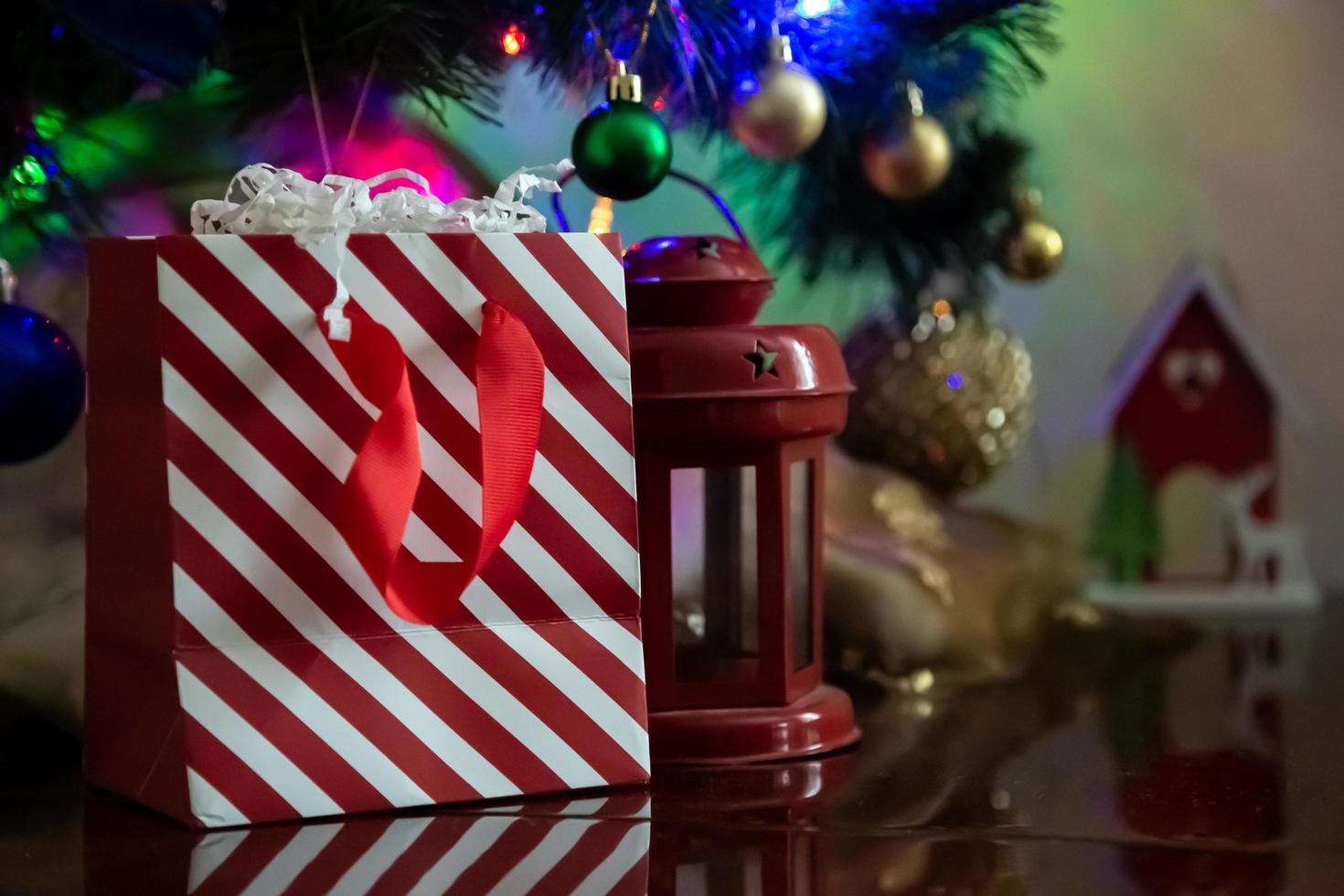 Striped red and white gift packet on a Christmas background photo