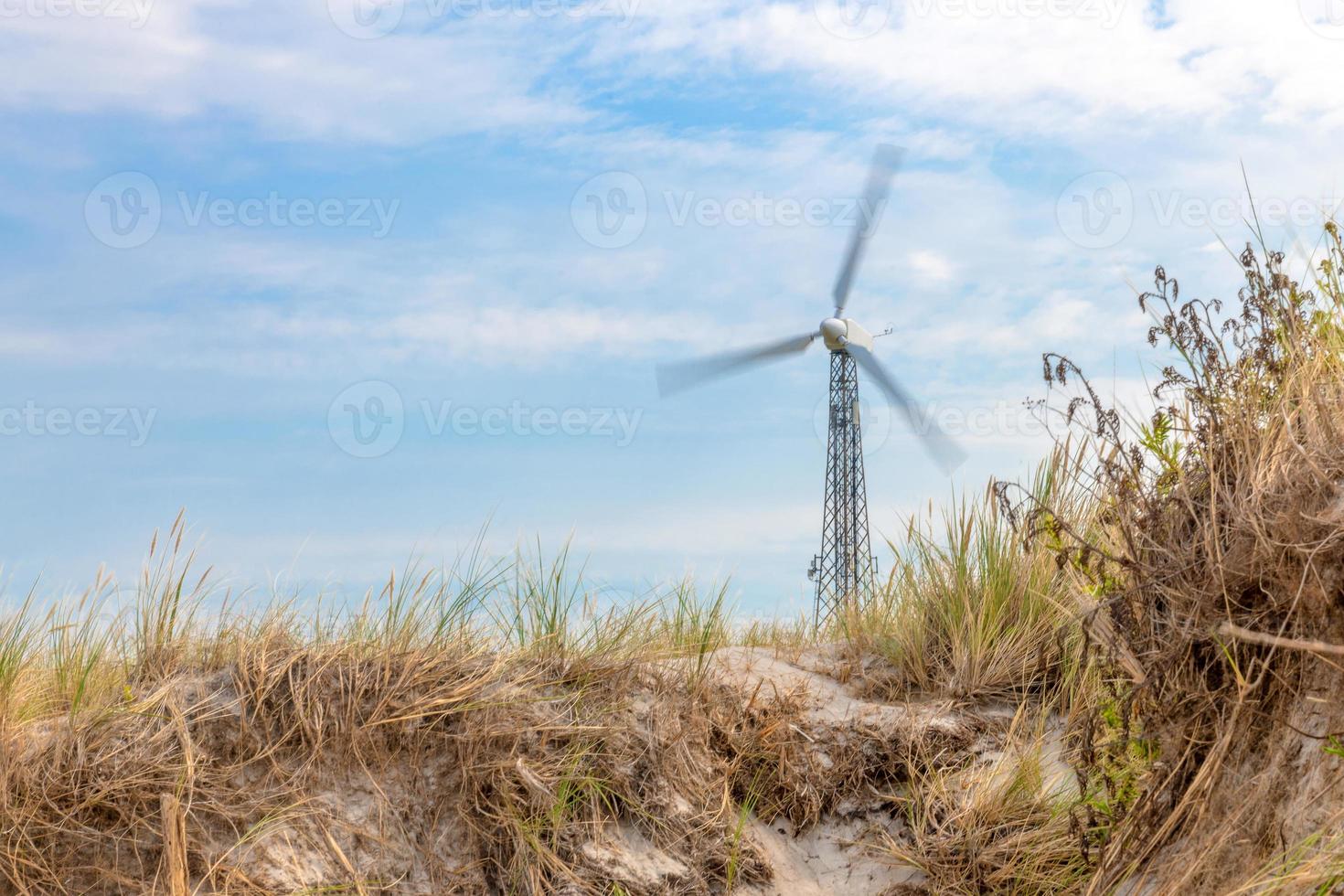 German Baltic Sea coast with wind turbine sand dunes and grass photo