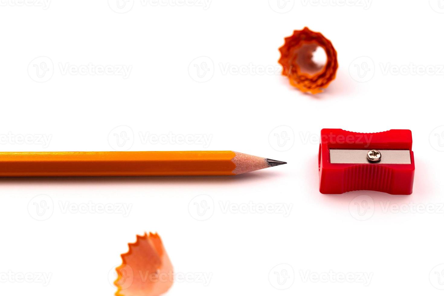 Pencil and sharpener on a white background photo