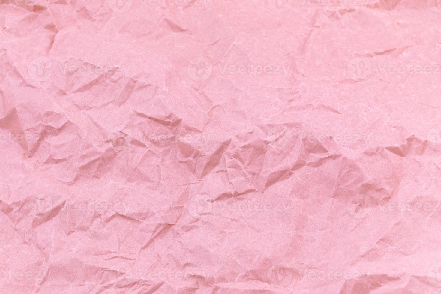 Texture of pink craft crumpled paper background photo