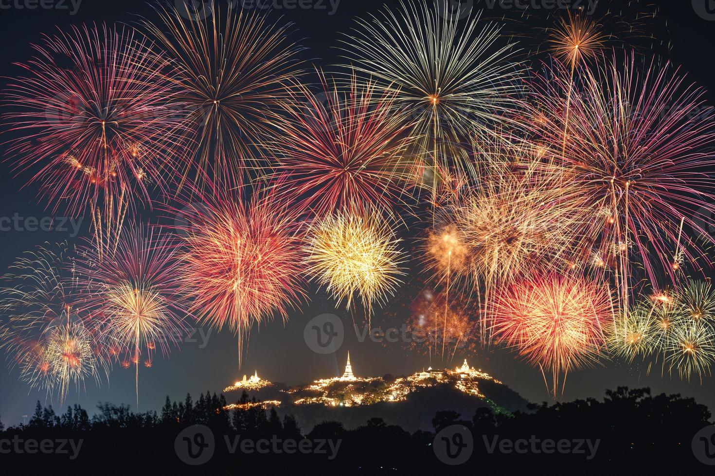 The annual festival fireworks celebration on golden pagoda of Khao Wang photo