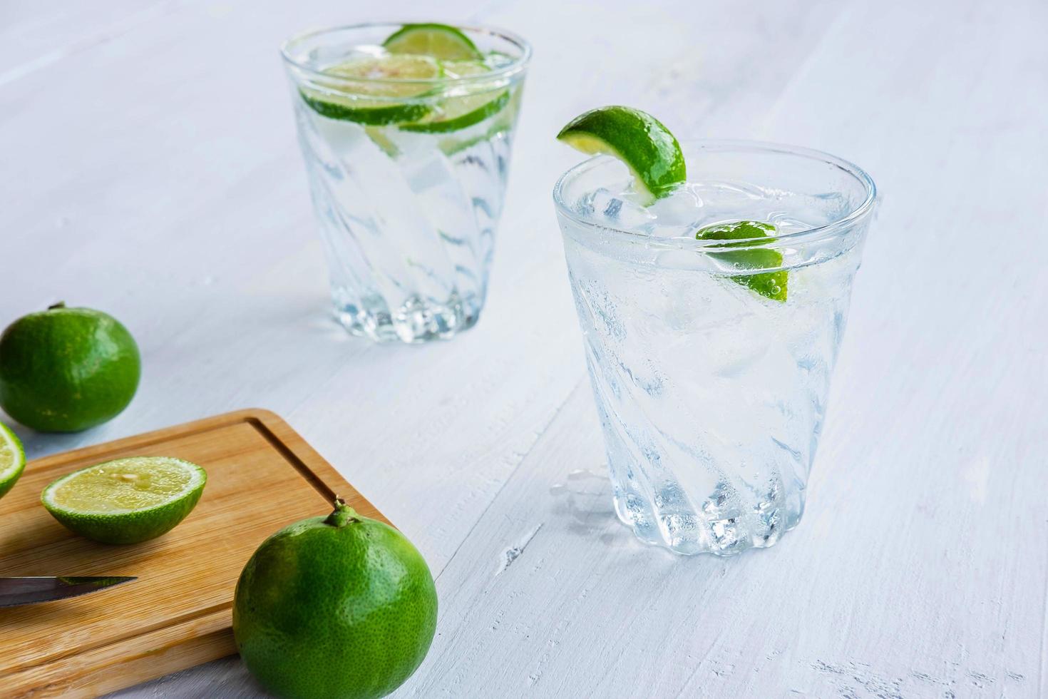 A glass of soda lemon and lime on the table photo